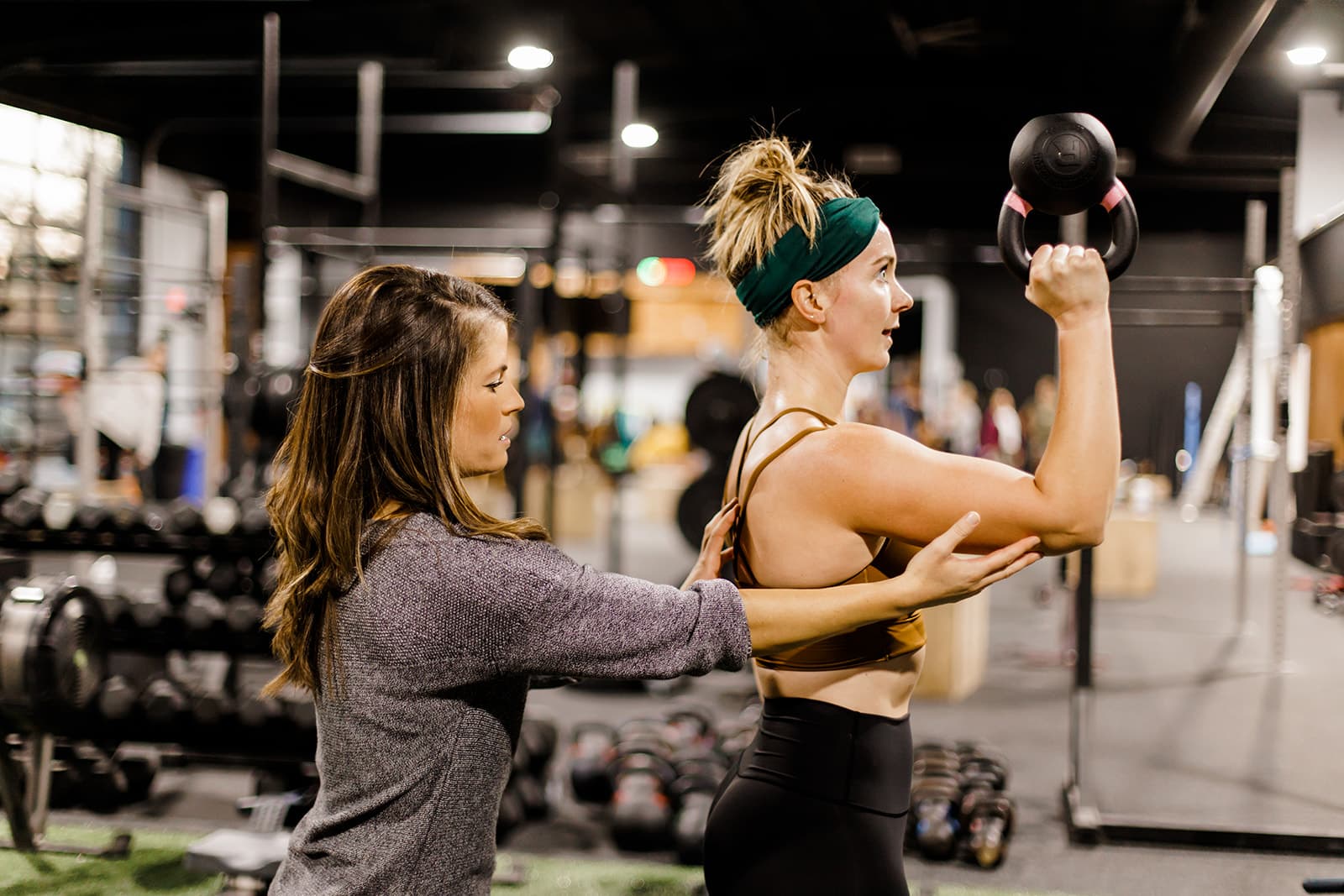 A coach working one-on-one with a member